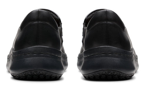 Two black slip-on shoes viewed from the back showing the heel.