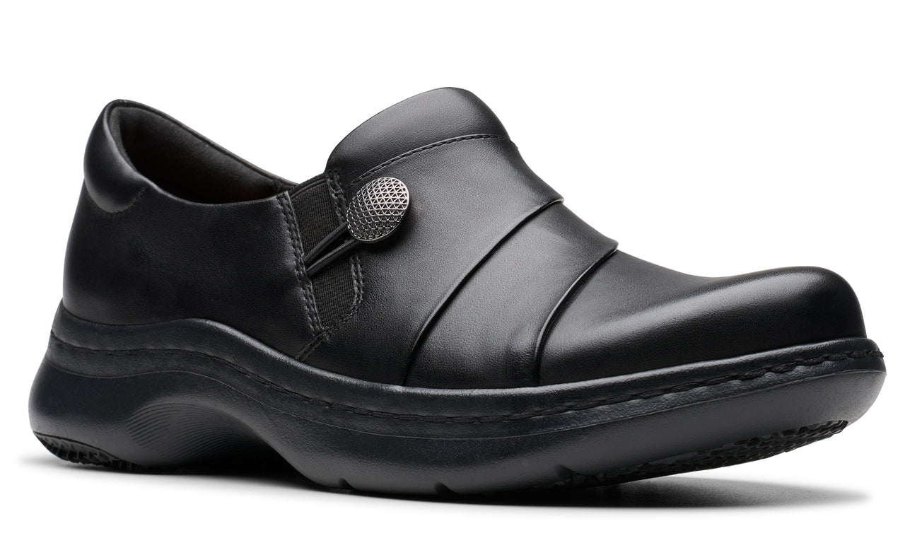Black slip-on shoe with a decorative button.