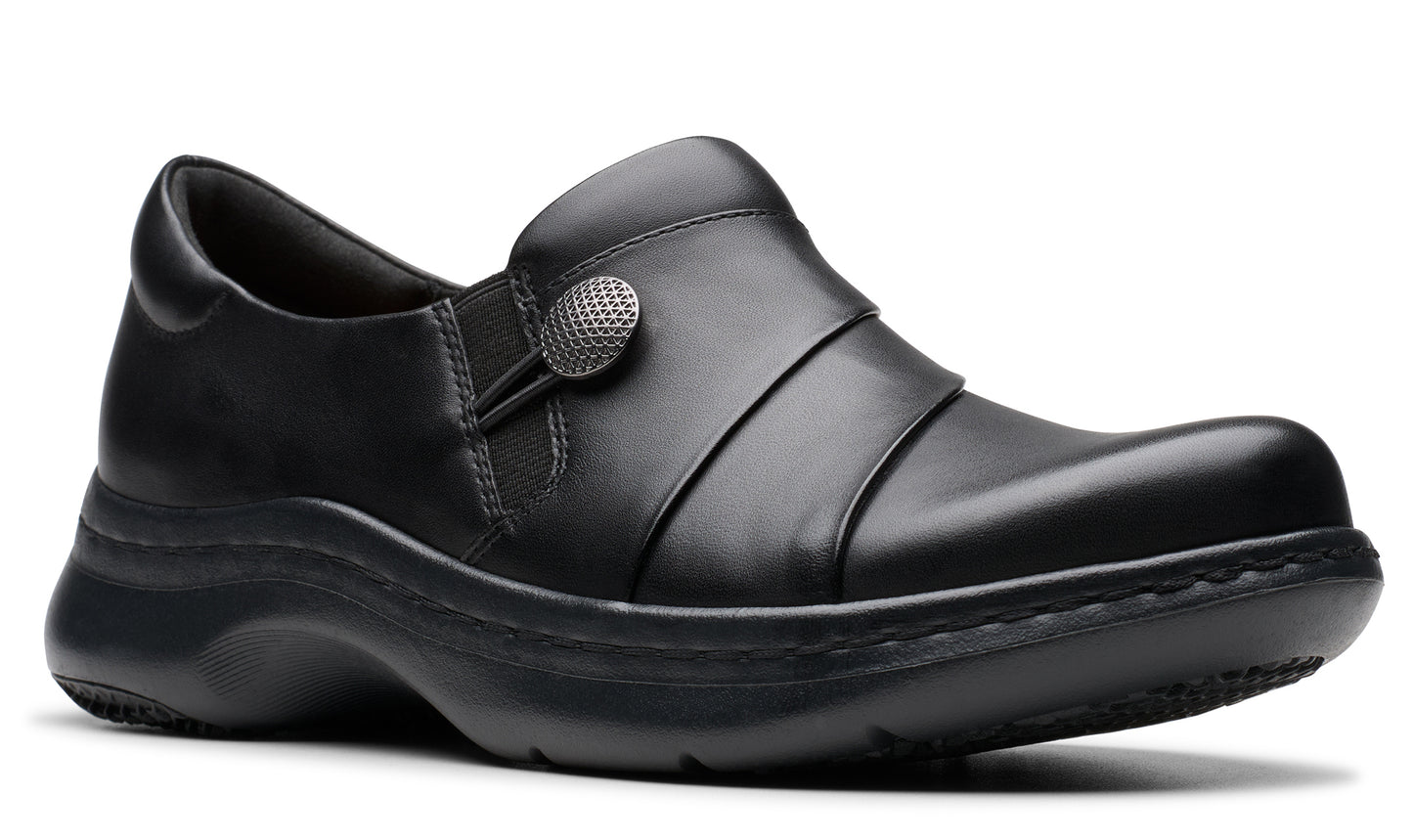 Black slip-on shoe with a decorative button.