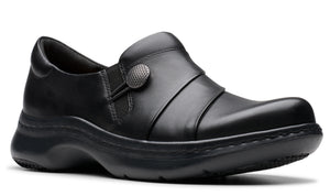 Black slip-on shoe with a decorative button.