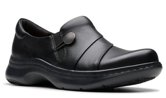 Black slip-on shoe with a decorative button.