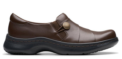 Brown leather loafer with button detail and black sole.
