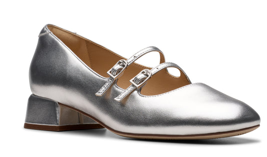 Silver Mary Jane style shoe with a block heel and double buckle straps.