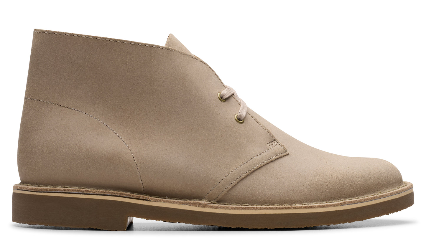 Tan ankle-high desert boot with laces and a rubber sole.