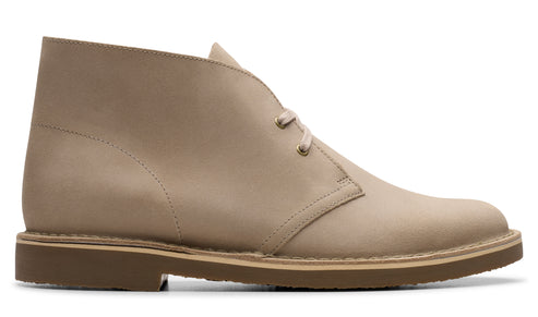 Tan ankle-high desert boot with laces and a rubber sole.
