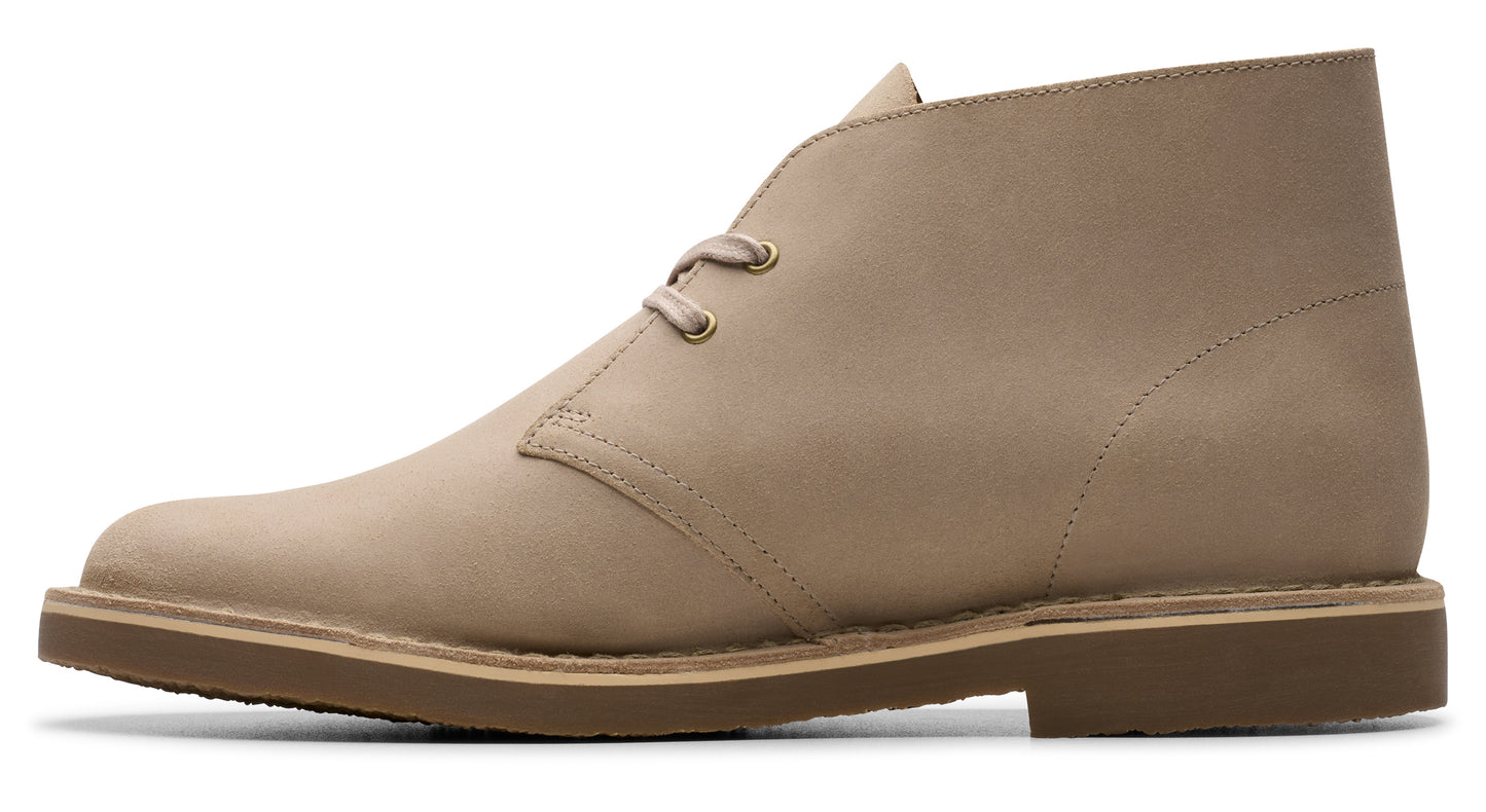 Beige ankle-high boot with lace-up closure and crepe sole.