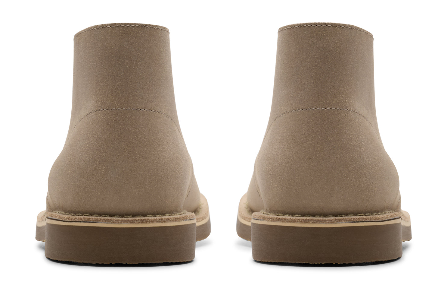 Pair of ankle-high tan boots showing back profile, low heel.