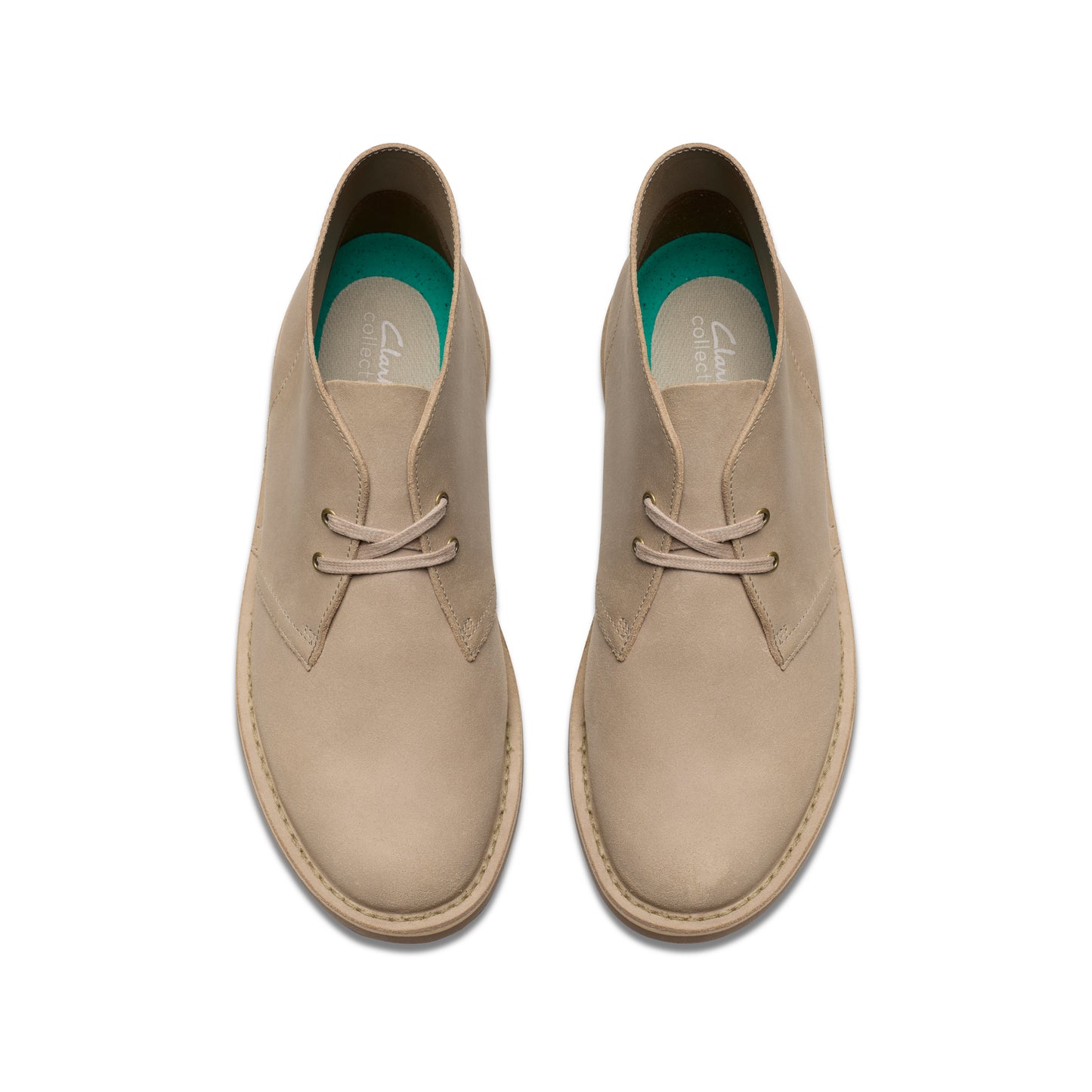 Tan-colored leather chukka boots viewed from above.