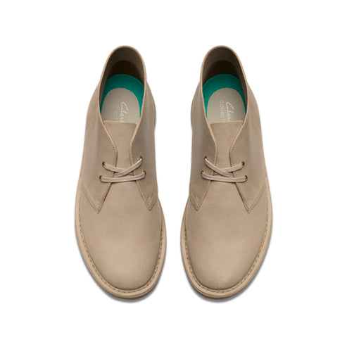 Tan-colored leather chukka boots viewed from above.