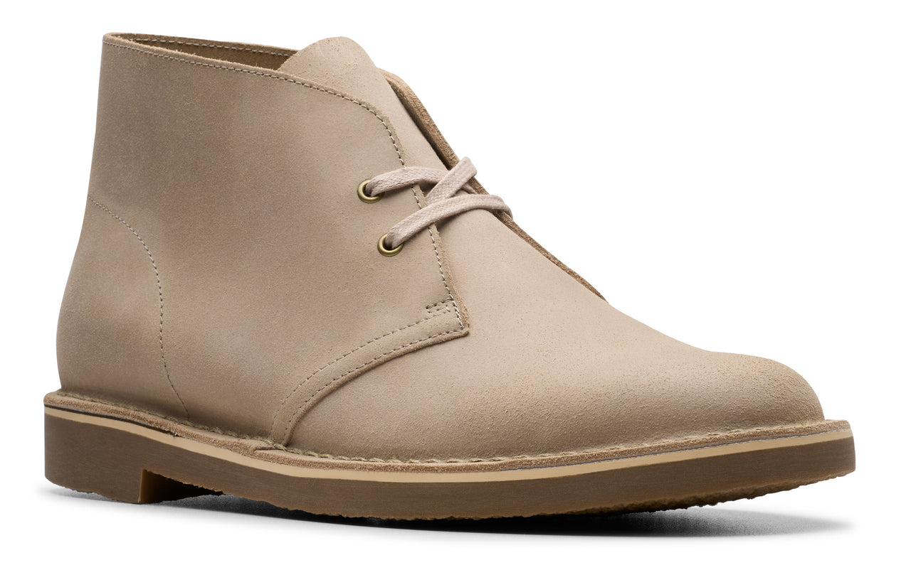 Beige leather desert boot with laces and crepe sole.