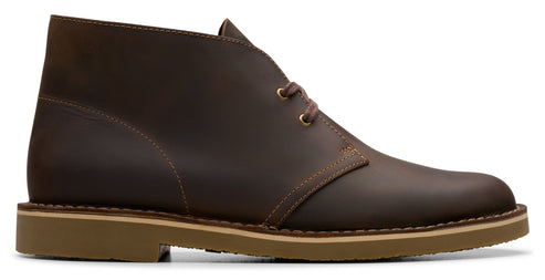 Leather ankle boot with lace-up closure and crepe sole.