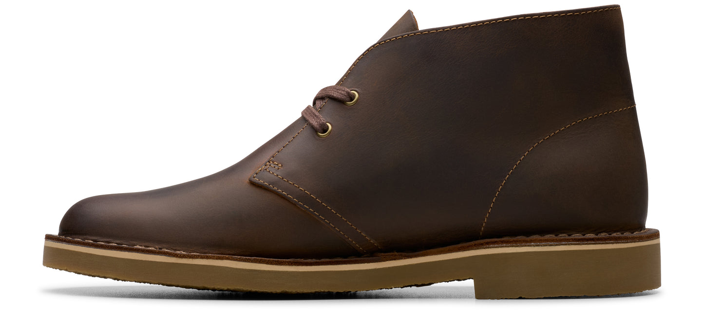 Brown leather chukka boot with two eyelets.