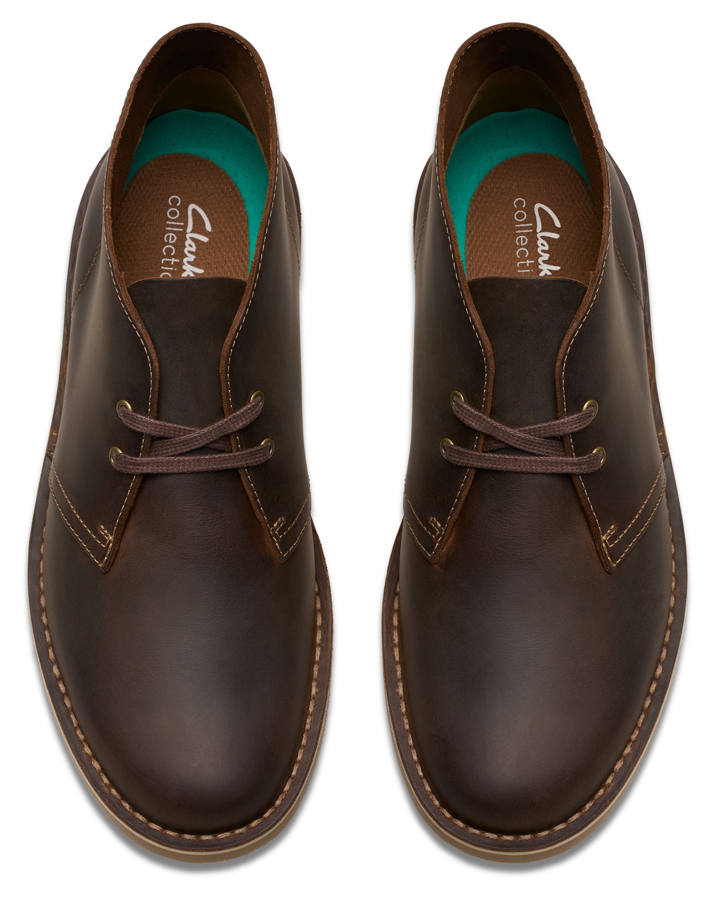 Pair of brown leather chukka boots with dark brown laces.