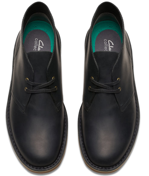 Overhead view of black leather ankle-high lace-up boots