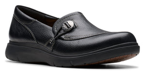 Black slip-on shoe with decorative button.