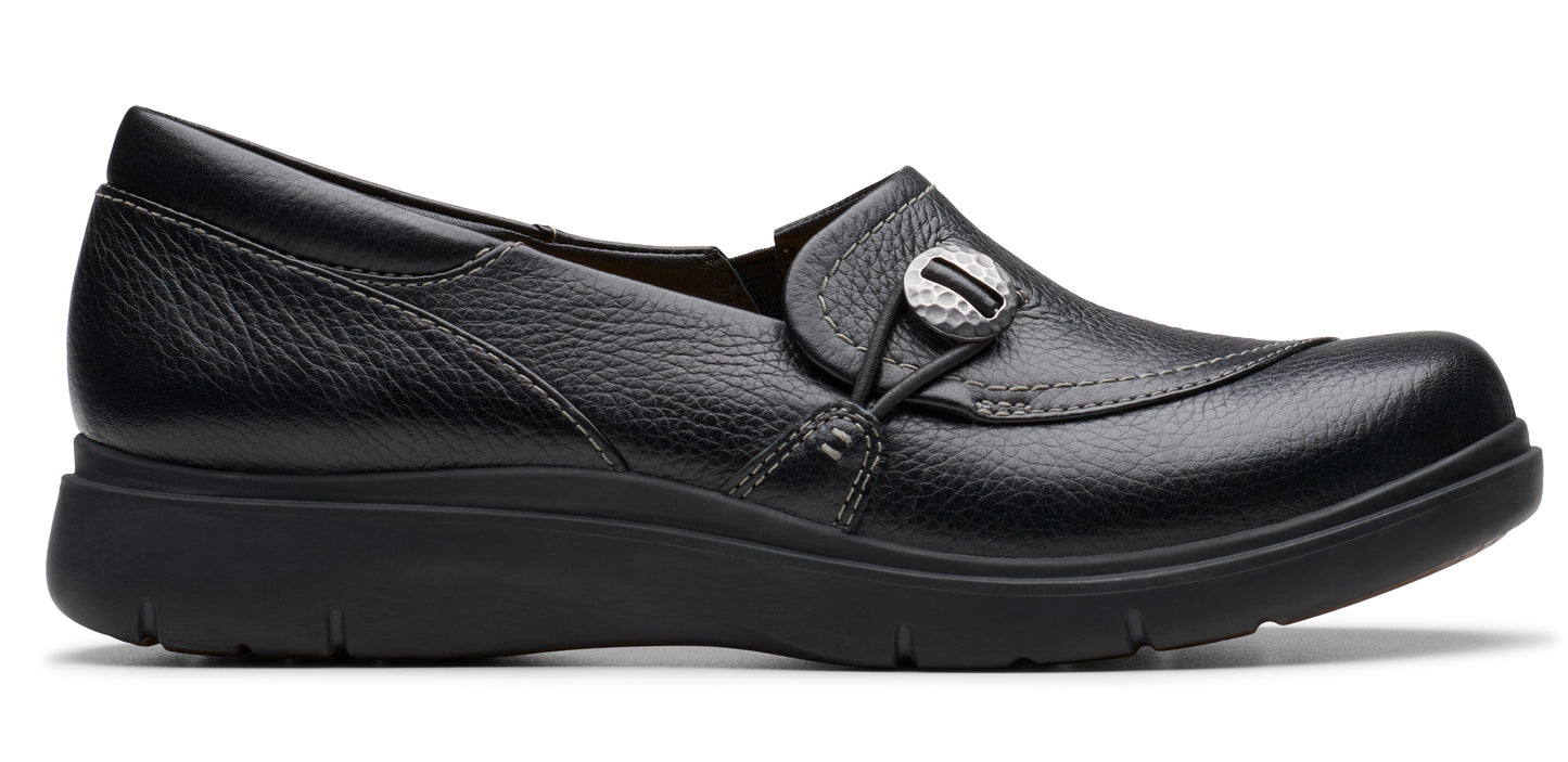 Black slip-on shoe with a decorative button.