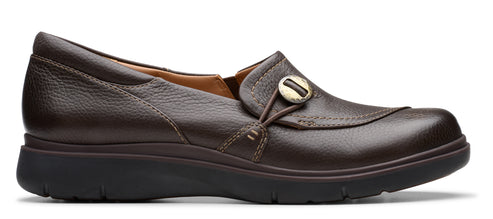 Brown leather slip-on shoe with decorative button.