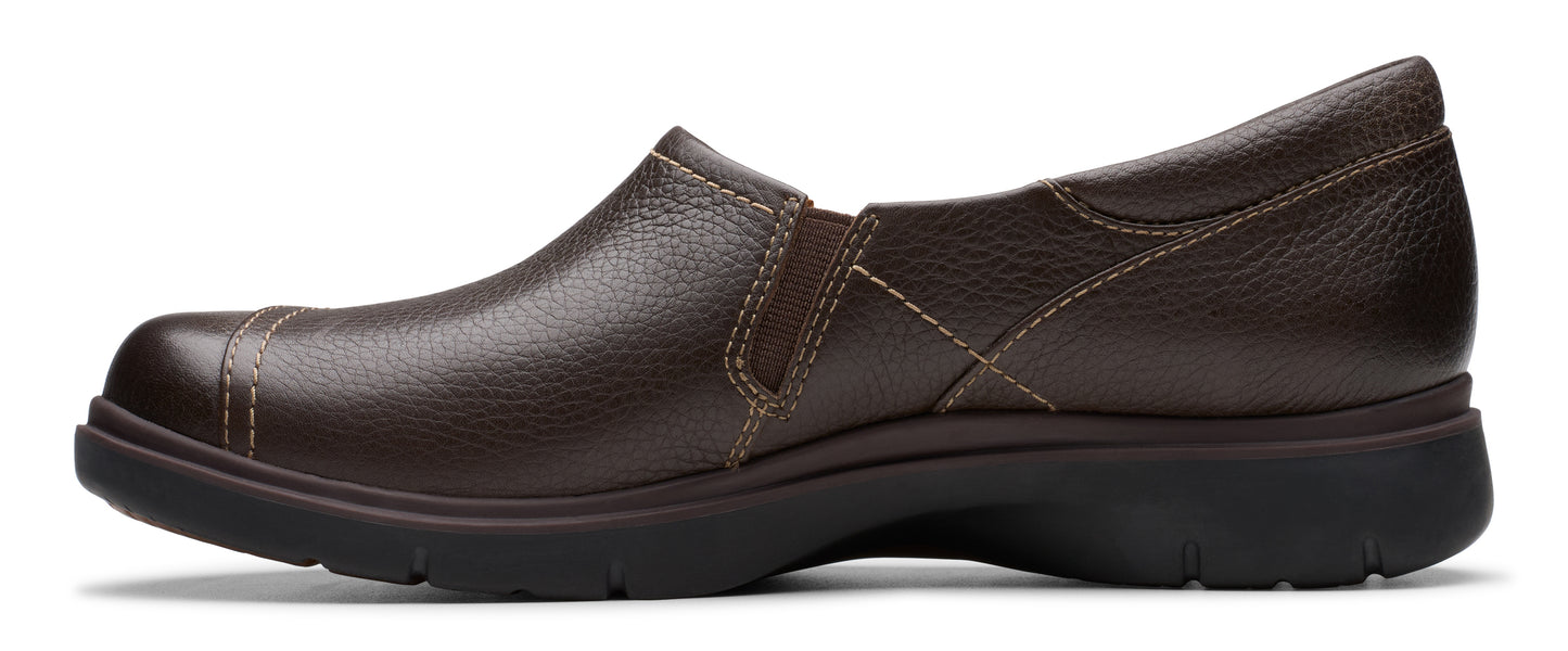 Brown leather slip-on shoe with a low heel.
