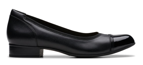 A black, low-heeled dress shoe with a rounded toe and glossy toe cap.