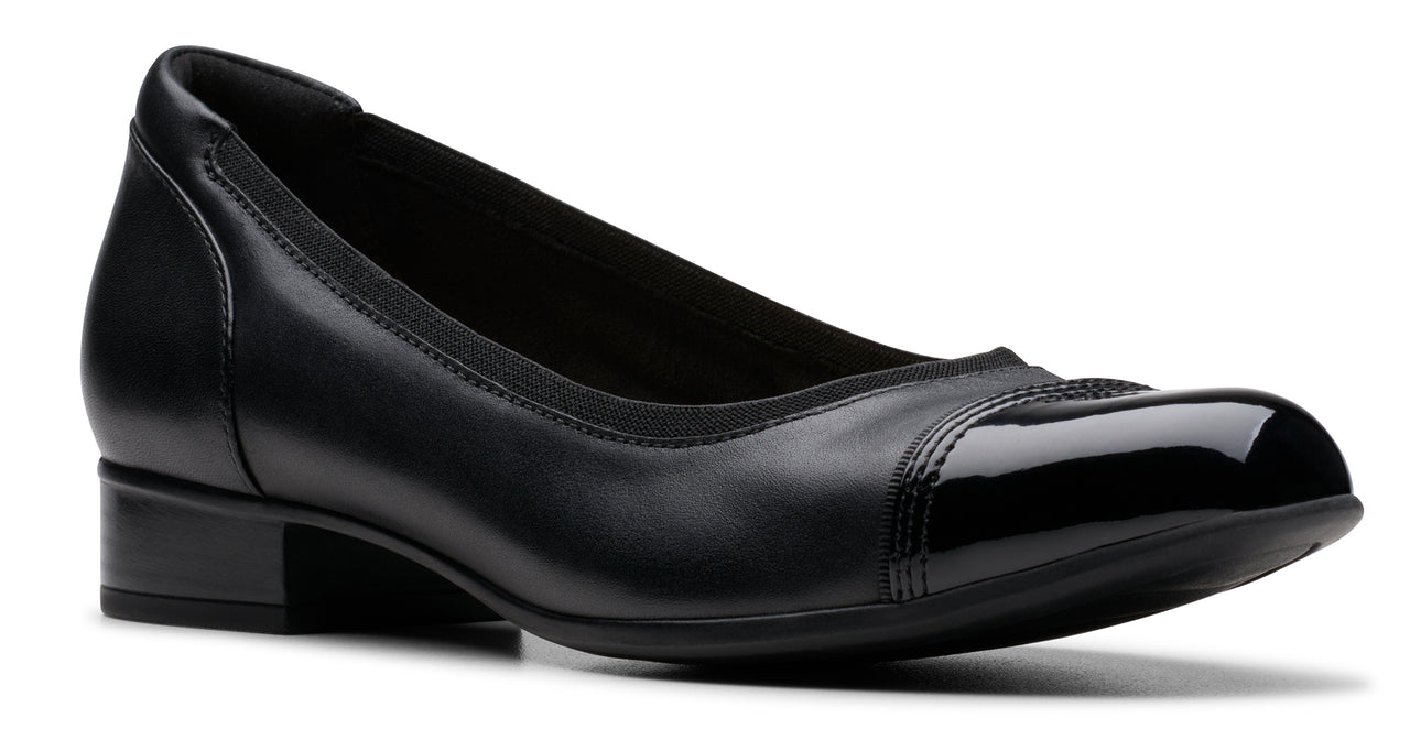 Black leather pump with patent leather toe.