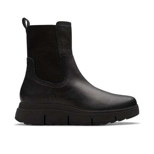 Black leather chelsea boot with a lug sole.