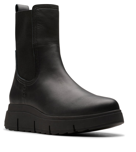 Black leather Chelsea boot with a thick, ridged sole and elastic side panels.