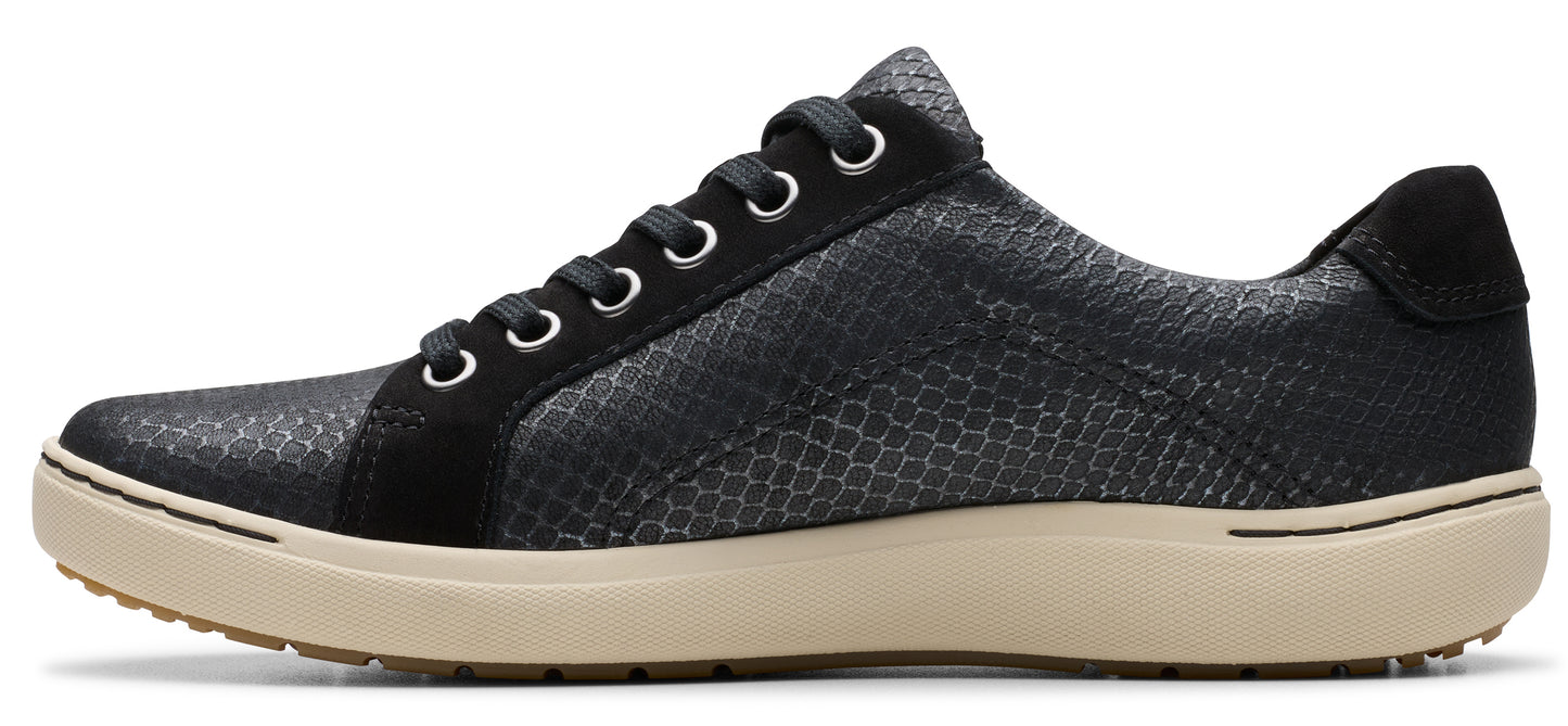 A snakeskin-patterned black sneaker with a cream sole.