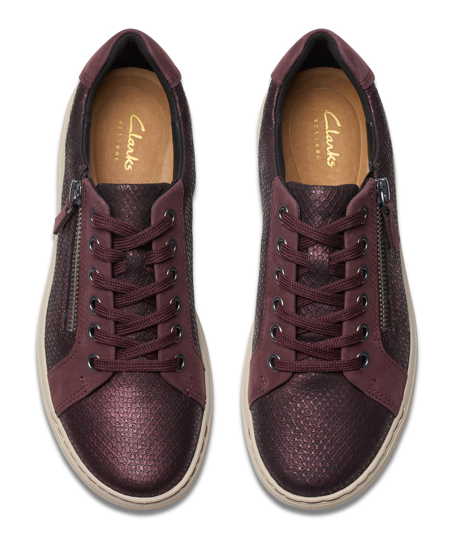 Pair of maroon sneakers with laces and a side zipper.