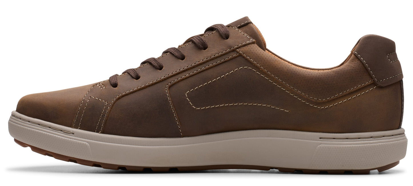 A brown leather sneaker with a beige sole.
