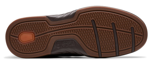 A brown shoe sole with a textured pattern.