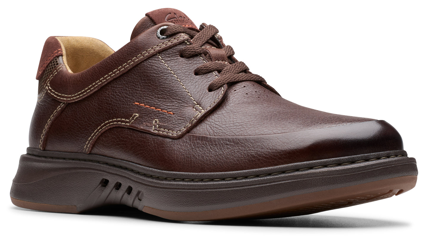 A brown leather casual shoe with brown laces and a dark brown rubber sole.