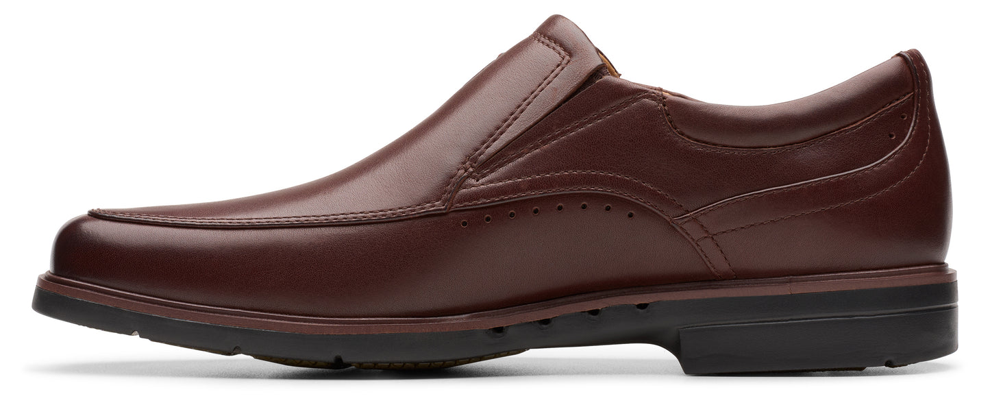 A brown leather slip-on dress shoe with a black sole.