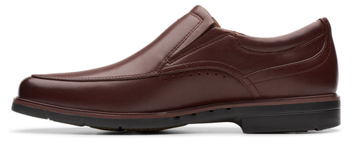 A brown leather slip-on dress shoe with a black sole.