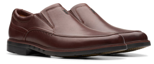 A pair of maroon slip-on dress shoes.