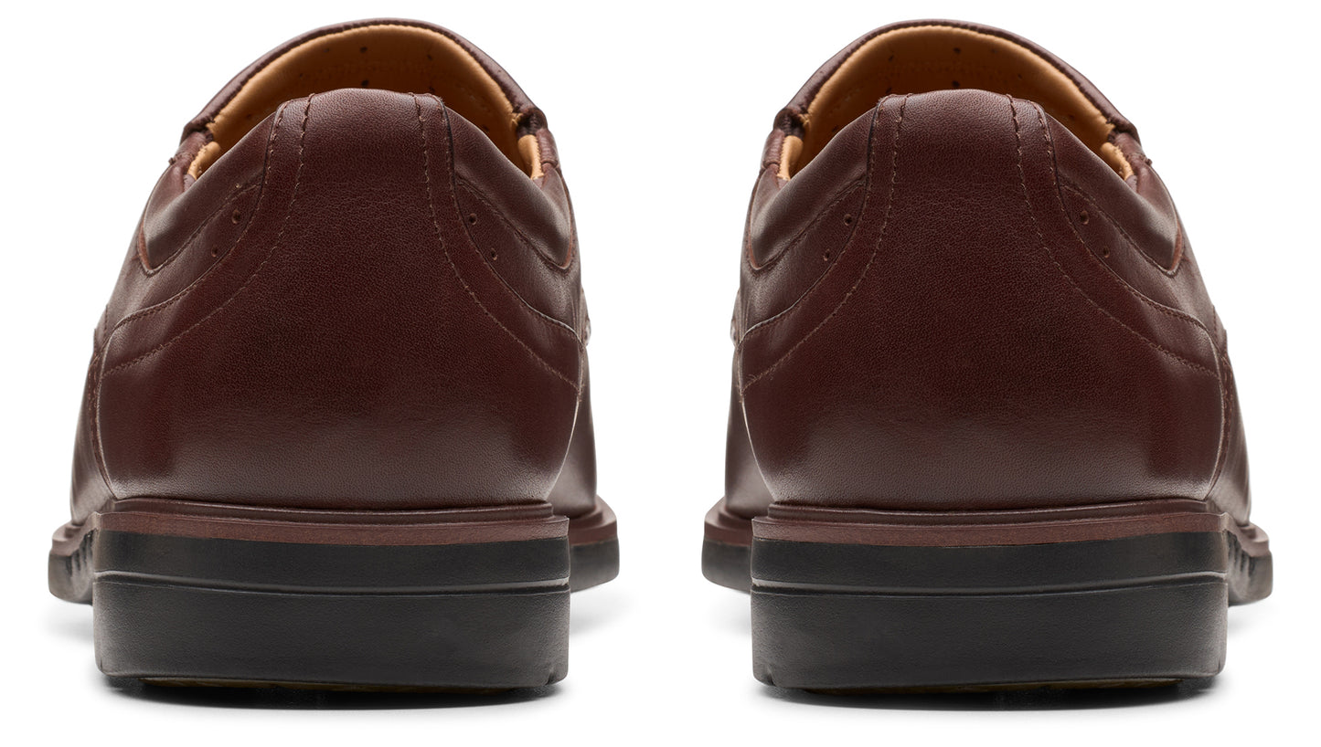 Pair of burgundy leather shoes, rear view.