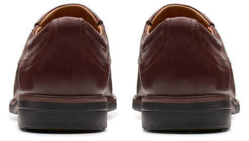 Pair of burgundy leather shoes, rear view.