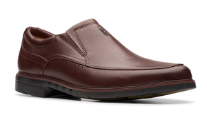 A men's brown leather slip-on dress shoe.