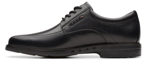 A black leather dress shoe with black laces.