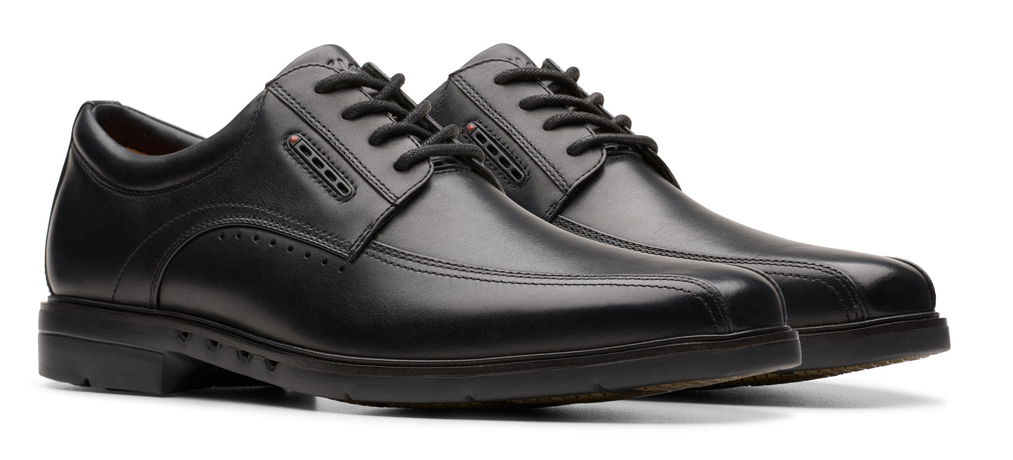 Pair of black dress shoes with laces.
