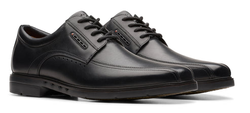 Pair of black dress shoes with laces.