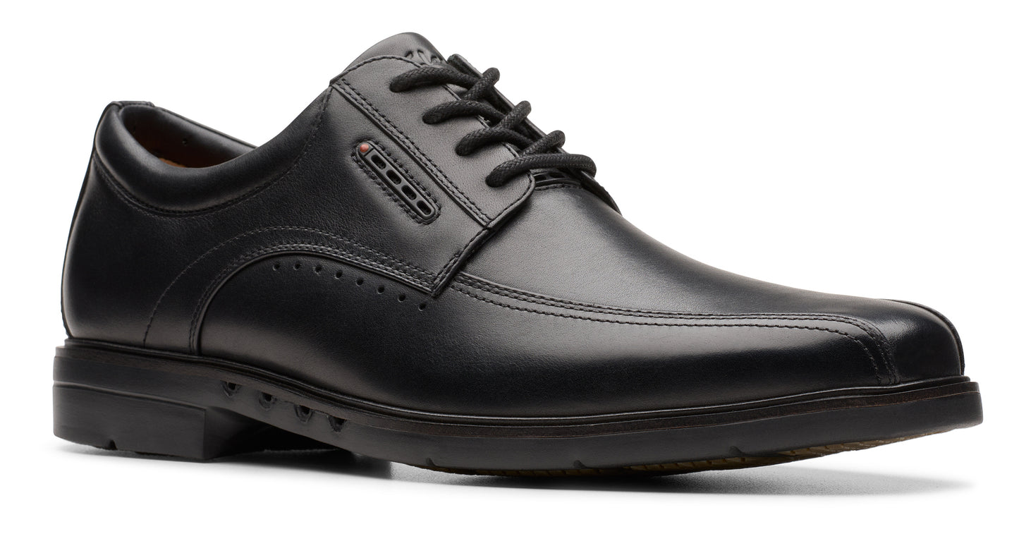 Black leather dress shoe with lace-up closure and a low heel.