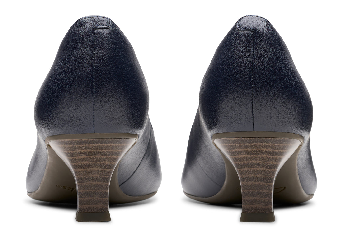 Pair of navy blue leather pumps with low heels.