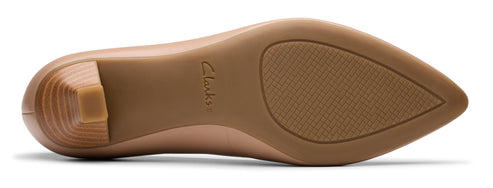 A light brown shoe sole with a geometric heel and the brand name Clarks printed on it.