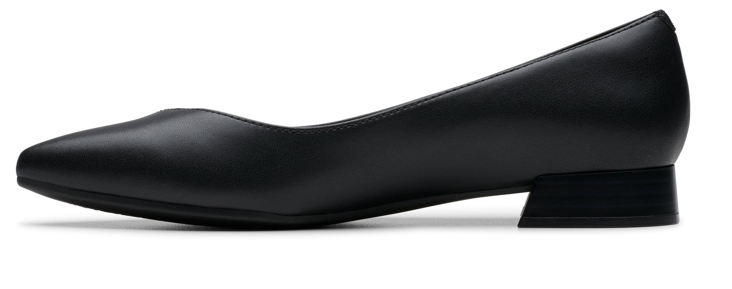 Black leather pump with a low block heel.