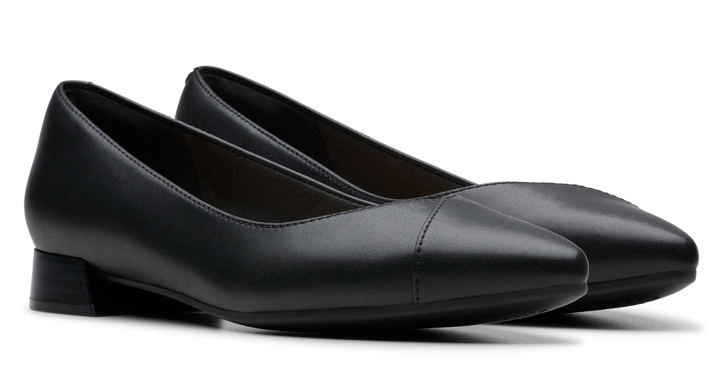 Pair of black leather closed-toe dress shoes with a low block heel.