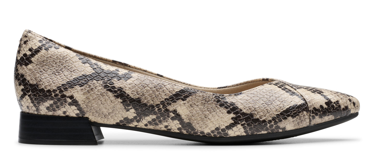 A snakeskin textured leather dress shoe with a low heel.