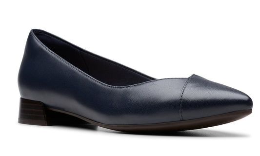 Navy blue leather pump with a short block heel and pointed toe.