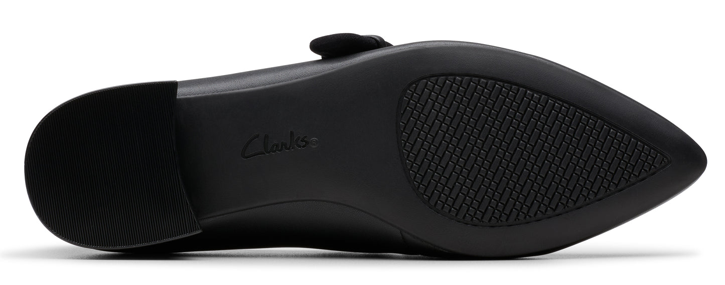 Bottom view of a black shoe with a textured sole and the brand name "Clarks" visible.