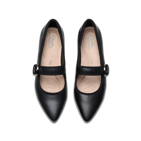 Pair of black leather Mary Jane style pumps with a buckle strap.