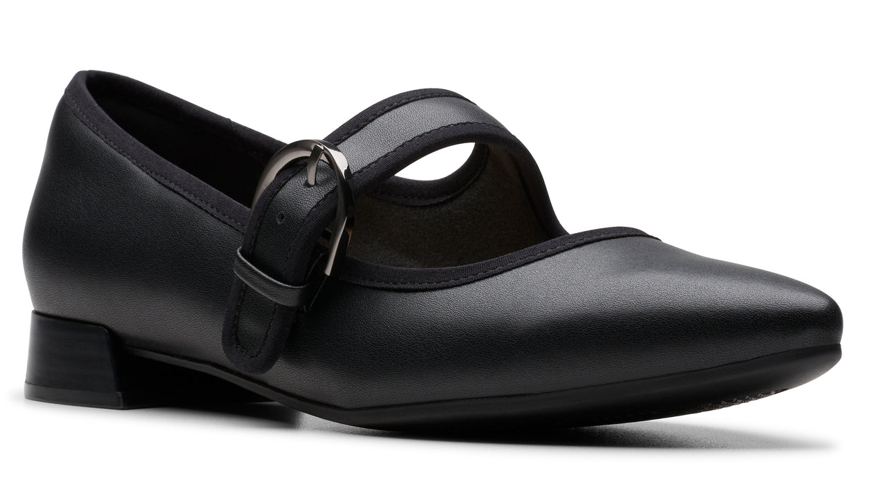 Black, leather Mary Jane shoe with a silver buckle and low block heel.